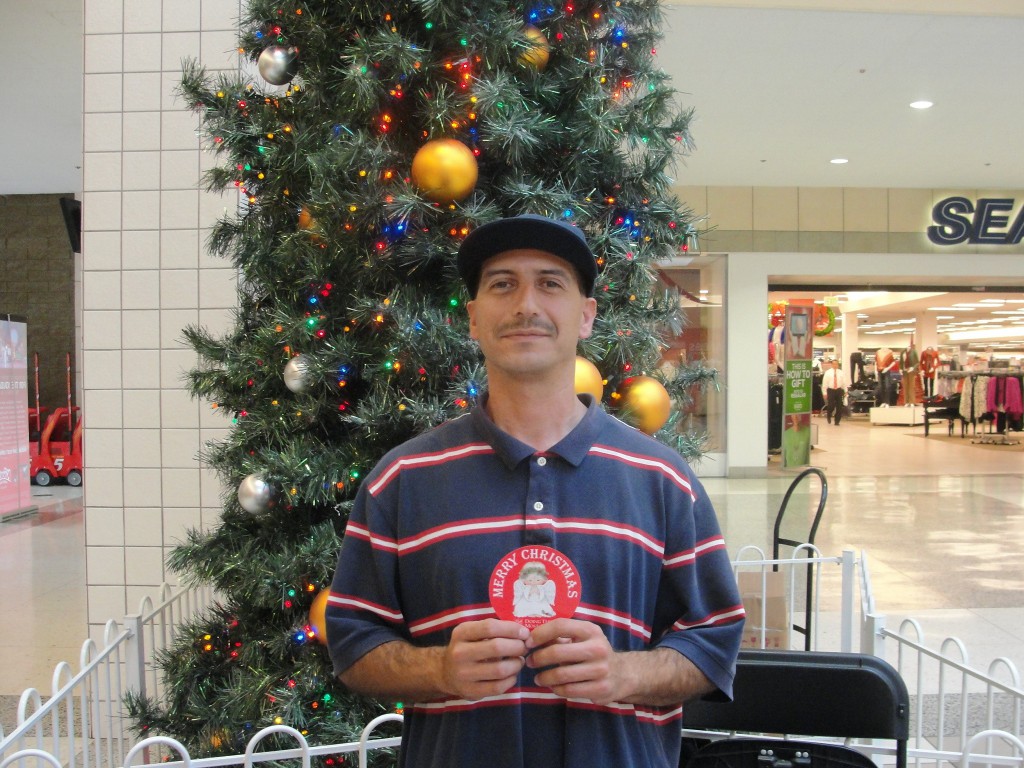 José Gonzalez is a first time volunteer with The Salvation Army, and chose to help the Giving Tree Program at the Inland Center Mall this year. “It feels good to be volunteering and collecting toys for kids this Christmas,” said Gonzalez. Photo by Paul Martinez.