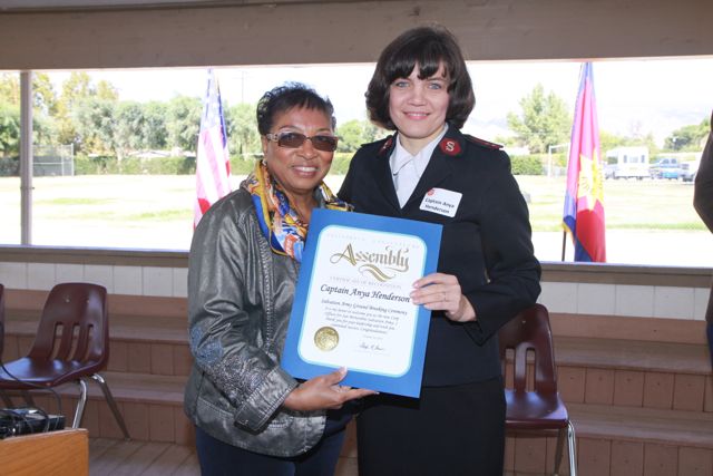 California Assemblymember Cheryl Brown presents a certificate to Captain Anya Henderson new Corps member for the San Bernardino area office. 