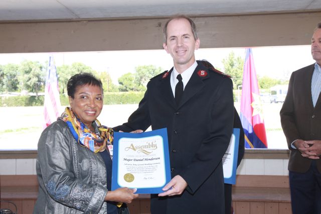California Assemblymember Cheryl Brown presents a certificate to Major Dan Anderson new Corps member for the San Bernardino area office. 
