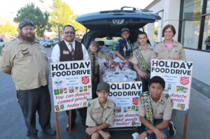 Collecting food for the hungry: Back row left to right Scout Leader Charles Price, Stater Bros. Manager Jorge Moreno, Stone Price, Austin Price, Lucus Compagna, Scout Leader Anne Compagna. Front left William Anderson, and front right Jason Bun.
